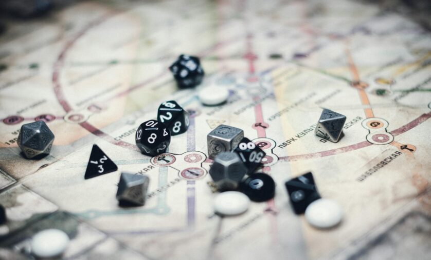 black and gray dice on white board game